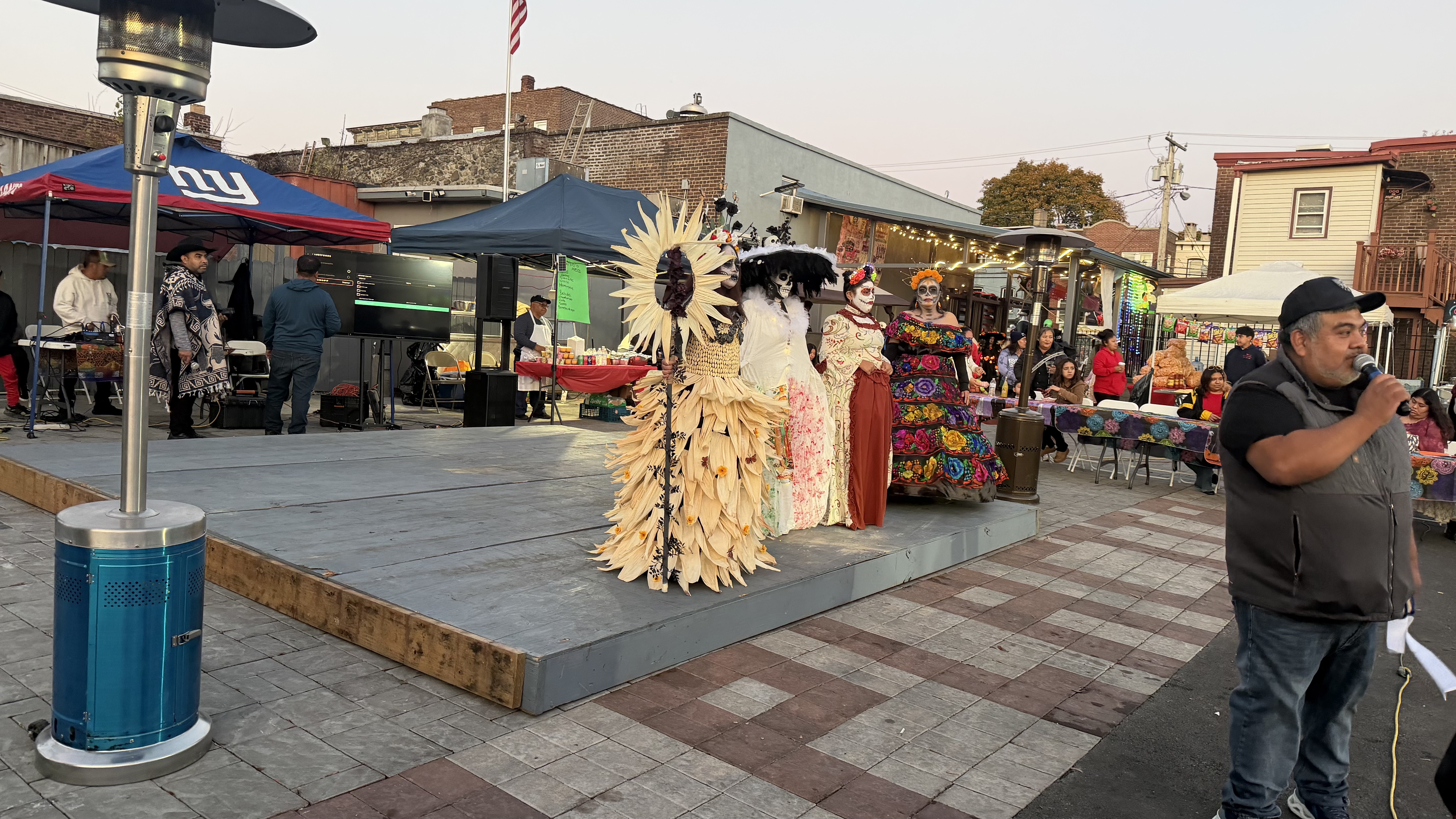 Catrinas on stage at Día de los Muertos celebration